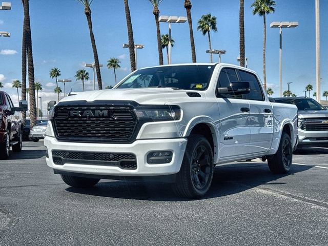 2025 RAM 1500 Big Horn Crew Cab 4x4 5'7" Box in White — front three-quarter view