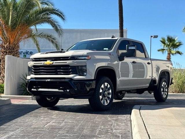 2026 Chevrolet Silverado 2500 HD Custom in White Sands — front three-quarter view